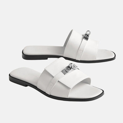 Aria – Mules nere eleganti con dettaglio gioiello